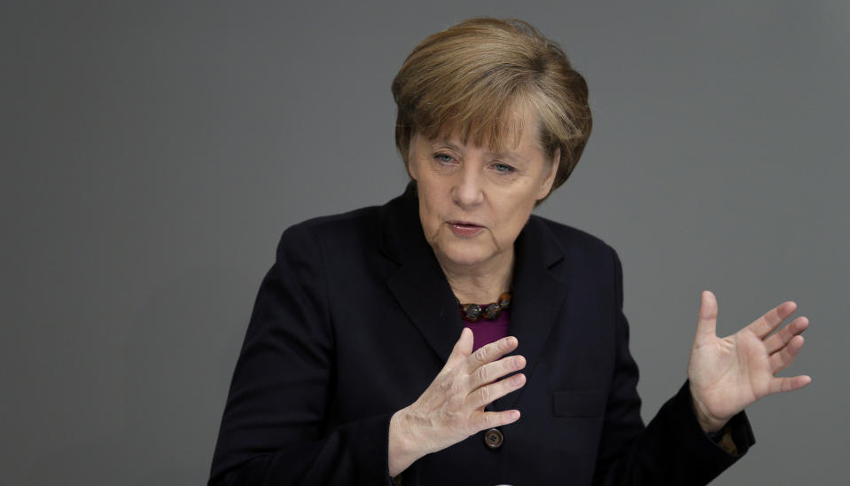 German Chancellor Angela Merkel gestures during a statement at the German parliament Bundestag, in Berlin, Thursday, March 20, 2014. Russia faces further sanctions from the European Union on Thursday over its annexation of the Crimea Peninsula as tensions in the region remained high despite the release of a Ukrainian naval commander. In an address to the German Parliament, Chancellor Angela Merkel said the EU was readying further sanctions and that the G-8 forum of leading economies had been suspended indefinitely. Russia holds the presidency of the G-8 and President Vladimir Putin was due to host his counterparts, including President Barack Obama, at a summit in Sochi in June. (AP Photo/Michael Sohn)