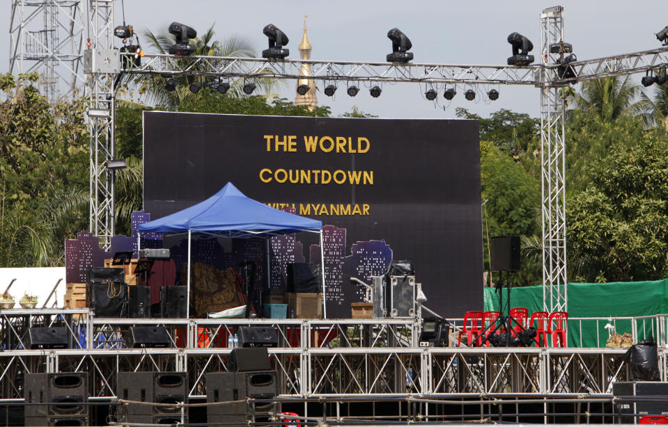 Preparations are underway for the country's first ever public New Year's countdown celebration, at Myoma grounds in Yangon, Myanmar, Monday, Dec. 31, 2012. Myanmar will ring in the new year with its first public countdown and a grand fireworks display Monday night in a celebration unprecedented in the former military-ruled country. (AP Photo/Khin Maung Win)