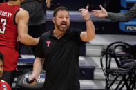 Texas Tech head coach Chris Beard signals to his team as they played against Arkansas in the first half of a second-round game in the NCAA men's college basketball tournament at Hinkle Fieldhouse in Indianapolis, Sunday, March 21, 2021. (AP Photo/Michael Conroy)