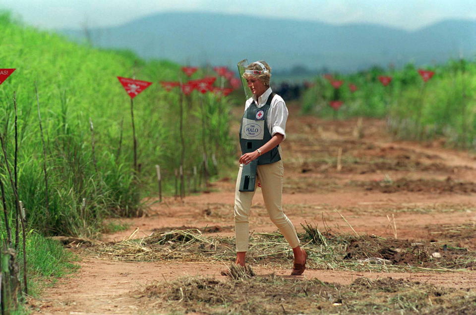 HUAMBO, ANGOLA - JANUARY 15:  Diana, Princess Of Wales, Walking Through A Cleared Area Of A  Mined Area Being Cleared By The Charity Halo Trust In Huambo, Angola, Wearing Protective Body Armour And A Visor.  (Photo by Tim Graham Photo Library via Getty Images)