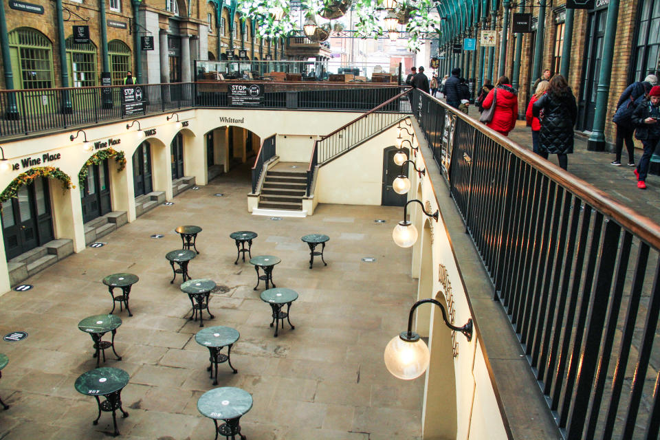 People walk along the Covent Garden market, where most shops are closed due to the on going second lockdown. (Photo by David Mbiyu / SOPA Images/Sipa USA)