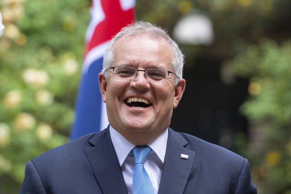 Australian Prime Minister Scott Morrison reacts after his meeting with Britain's Prime Minister Boris Johnson, in the garden of 10 Downing Streeet, in London, Tuesday June 15, 2021. Britain and Australia have agreed on a free trade deal that will be released later Tuesday, Australian Trade Minister Dan Tehan said. (Dominic Lipinski/Pool Photo via AP)