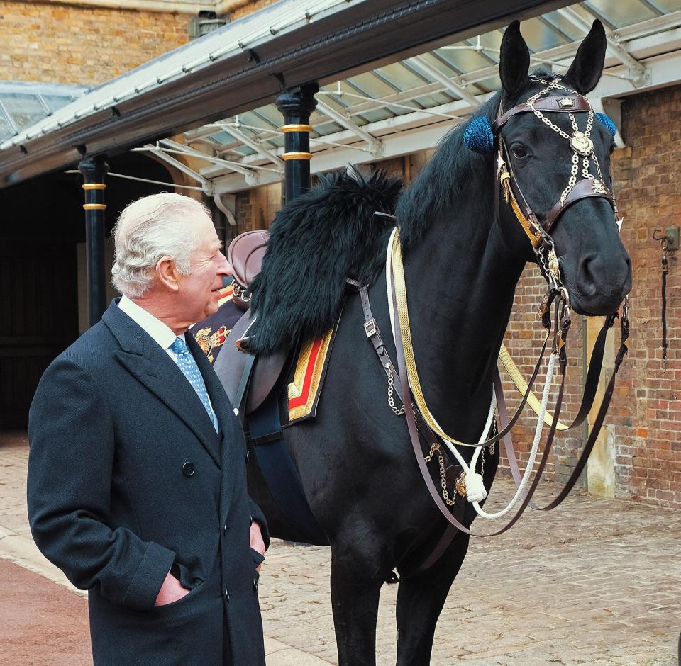 Embargoed until March 11, 2023 - 22:00 GMT / EMBARGOED UNTIL 2200 GMT on March 11, 2023 - An undated handout picture taken and released on March 11, 2023 by Buckingham Palace, shows Britain's King Charles III meeting the black mare 'Noble', a horse gifted to him by the Royal Canadian Mounted Police (RCMP), at the The Royal Mews in Windsor. - The relationship between the RCMP and The Royal Family dates back to 1904, when King Edward VII bestowed the title of Royal on the North-West Mounted Police, making it the Royal North-West Mounted Police. (Photo by BUCKINGHAM PALACE / AFP) / EMBARGOED UNTIL 2200 GMT on March 11, 2023 XGTY / RESTRICTED TO EDITORIAL USE - MANDATORY CREDIT "AFP PHOTO / BUCKINGHAM PALACE / PA WIRE " - NO MARKETING - NO ADVERTISING CAMPAIGNS - NO DIGITAL ALTERATION ALLOWED - DISTRIBUTED AS A SERVICE TO CLIENTS / ADDS EMBARGO EMBARGOED UNTIL 2200 GMT on March 11, 2023 The erroneous mention[s] appearing in the metadata of this photo by - has been modified in AFP systems in the following manner: [---] instead of [---]. Please immediately remove the erroneous mention[s] from all your online services and delete it (them) from your servers. If you have been authorized by AFP to distribute it (them) to third parties, please ensure that the same actions are carried out by them. Failure to promptly comply with these instructions will entail liability on your part for any continued or post notification usage. Therefore we thank you very much for all your attention and prompt action. We are sorry for the inconvenience this notification may cause and remain at your disposal for any further information you may require. (Photo by -/BUCKINGHAM PALACE/AFP via Getty Images)