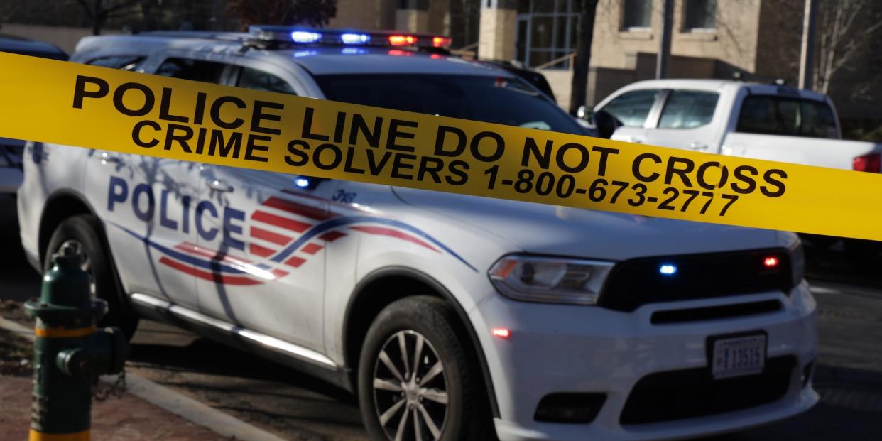 A car for the Metropolitan Police Department of the District of Columbia with yellow police line tape