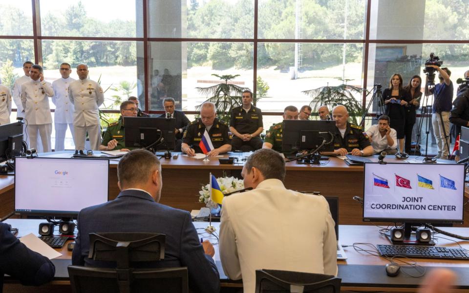 Delegates and military officers from Russia, Ukraine, Turkey, and UN attend the opening ceremony of the joint coordination centre - UMIT BEKTAS/REUTERS