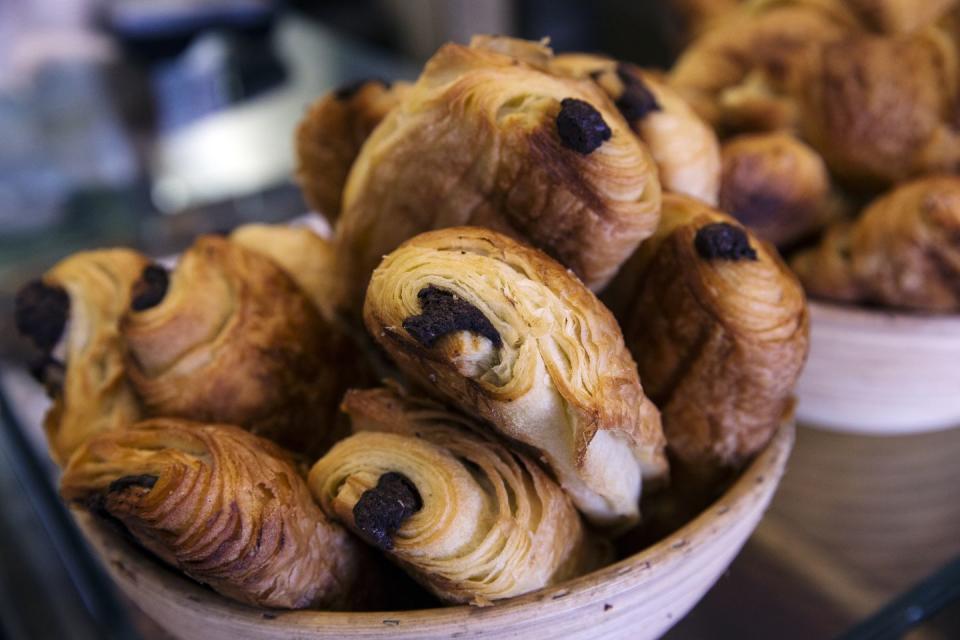a basket of chocolate croissants