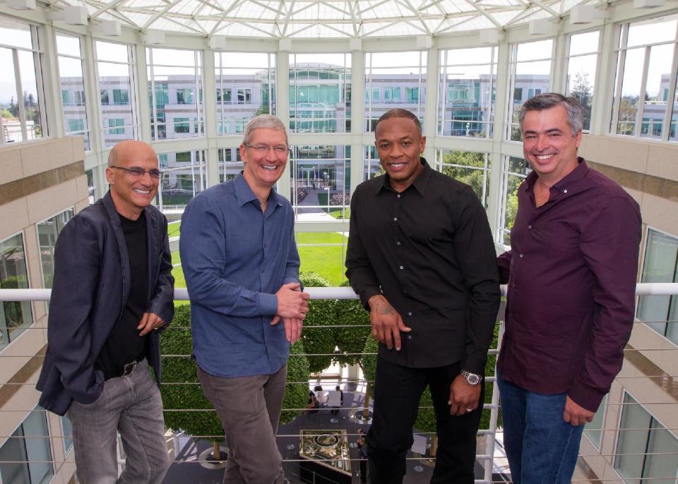 Apple acquires Beats Electronics in May 2014. Above: Jimmy Iovine, Tim Cook, Dr. Dre, and Eddy Cue. (AP Photo/Apple, Paul Sakuma)