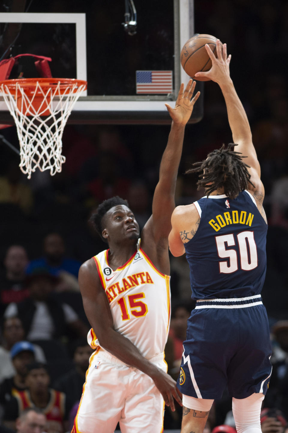 Denver Nuggets forward Aaron Gordon shoots over Atlanta Hawks center Clint Capela during the first half of an NBA basketball game Friday, Dec. 2, 2022, in Atlanta. (AP Photo/Hakim Wright Sr.)