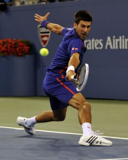 Novak Djokovic of Serbia returns to Andy Murray of Great Britain during their 2012 US Open men's singles finals match in New York on September 10, 2012