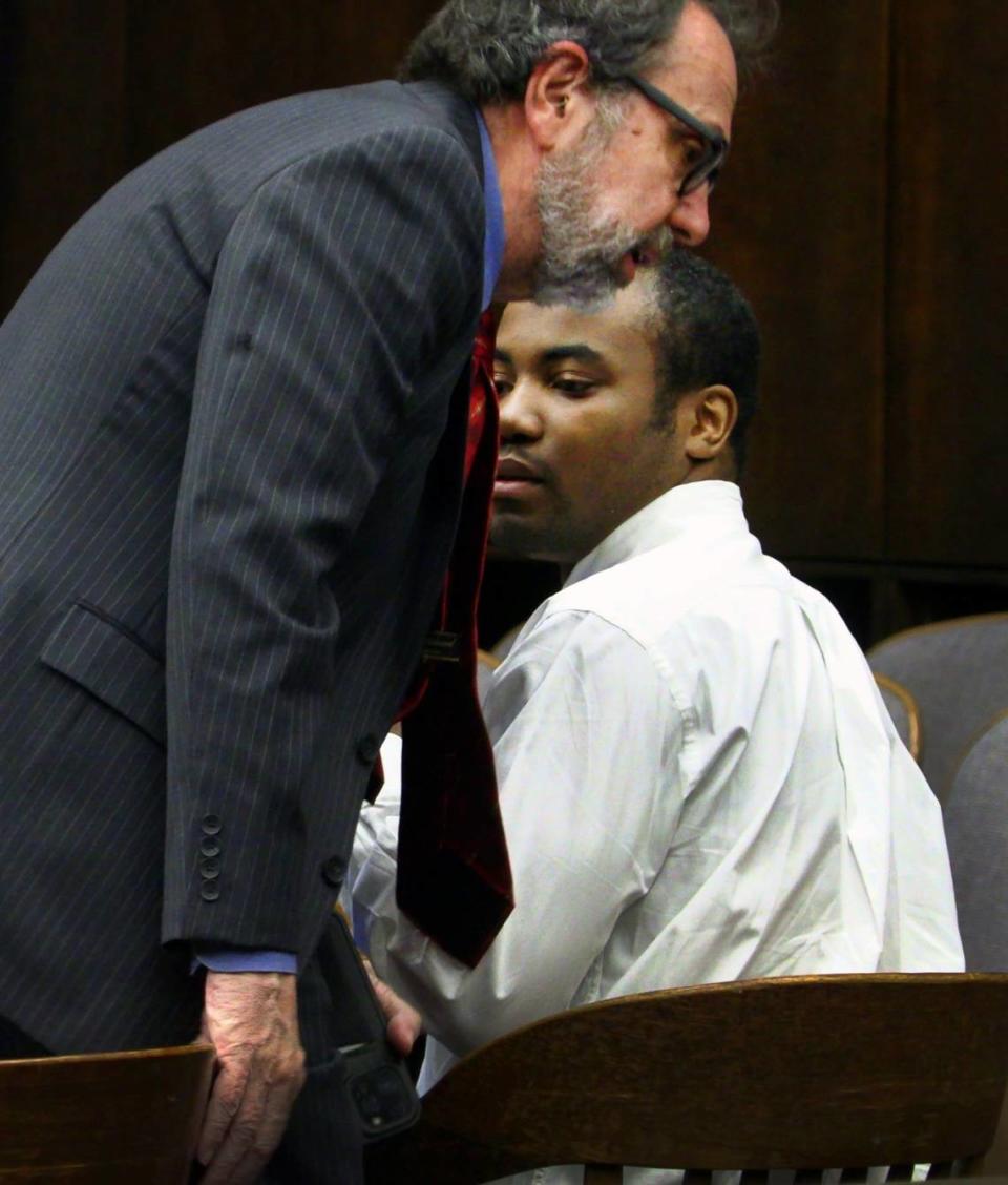 Jayvon Rayshawn Hatchett, seated right, speaks with his defense attorney Steve Craft Thursday morning. 03/23/2023