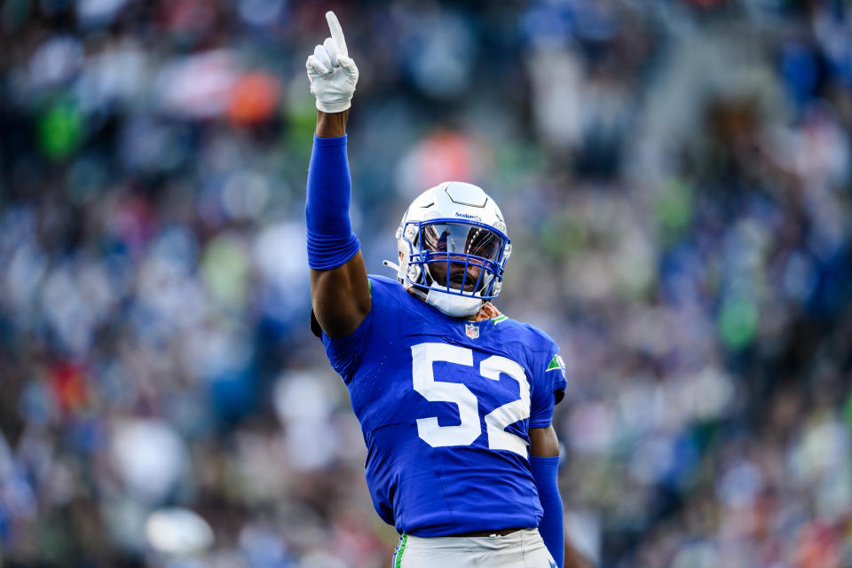 SEATTLE, WASHINGTON - OCTOBER 29: Darrell Taylor #52 of the Seattle Seahawks celebrates during the fourth quarter of the game against the Cleveland Browns at Lumen Field on October 29, 2023 in Seattle, Washington. (Photo by Jane Gershovich/Getty Images)