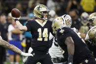 New Orleans Saints quarterback Andy Dalton (14) throws a pass during the first half of an NFL football game against the Las Vegas Raiders Sunday, Oct. 30, 2022, in New Orleans. (AP Photo/Butch Dill)