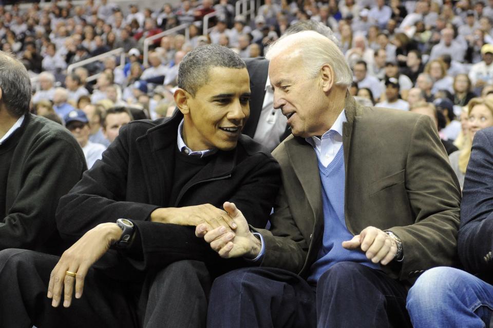 President Barack Obama and Vice President Joe Biden talk during a college basketball game between the Georgetown Hoyas and the Duke Blue Devils on Jan. 30, 2010 at the Verizon Center in Washington, D.C.