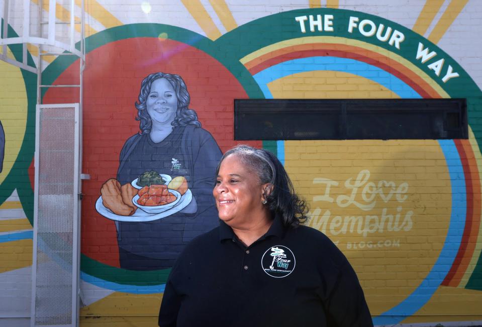 Patrice Thompson, owner of the Four Way, stands in front the restaurant's new mural, created by artist Danielle Sierra during Black History Month, paying tribute to its 75 years of business in the Soulsville community. 