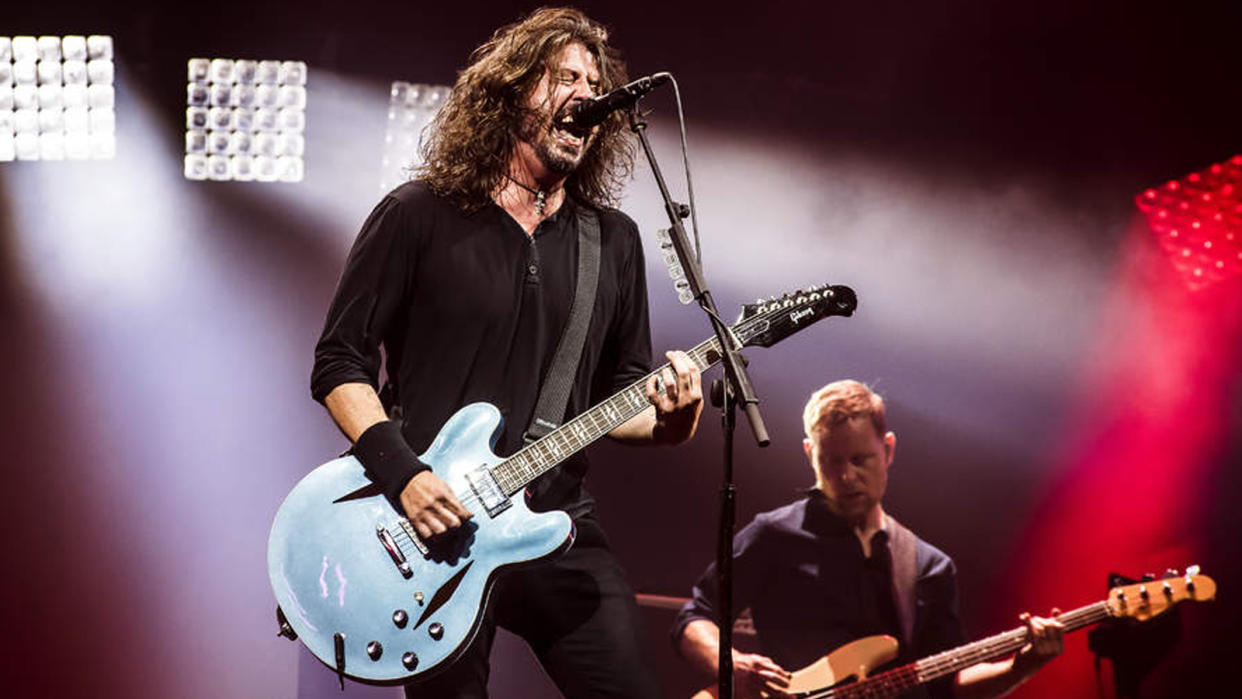  Dave Grohl performing live with Foo Fighters . 