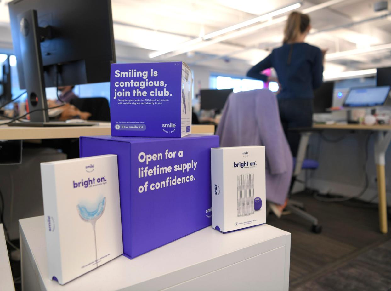 SmileDirectClub sends teeth aligners to people, helping people more easily straighten their teeth than traditional braces. Boxes are displayed throughout the company's Nashville office.