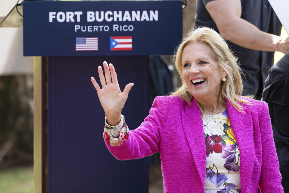 First Lady Jill Biden waves to attendees during an event with military families at Fort Buchanan in San Juan, Puerto Rico, Sunday, March. 17, 2024. (AP Photo/Alejandro Granadillo)