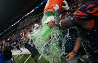 UTSA head coach Jeff Traylor, center, is doused by his players after their win over Western Kentucky in an NCAA college football game in the Conference USA Championship, Friday, Dec. 3, 2021, in San Antonio. (AP Photo/Eric Gay)