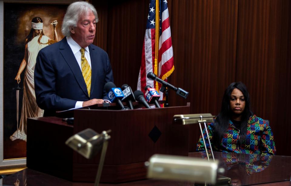 Geoffrey Fieger speaks in front of media members as Porter Burks' mother, Quieauna Wilson, sits next to Fieger during a press conference held on the police killing of Porter Burks inside Fieger Law in Southfield on Oct. 6, 2022.