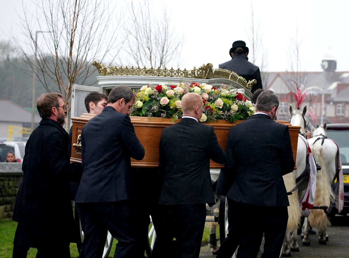 Pallbearers carried the coffin of Elle Edwards to St Nicholas’s Church in Wallasey (PA)