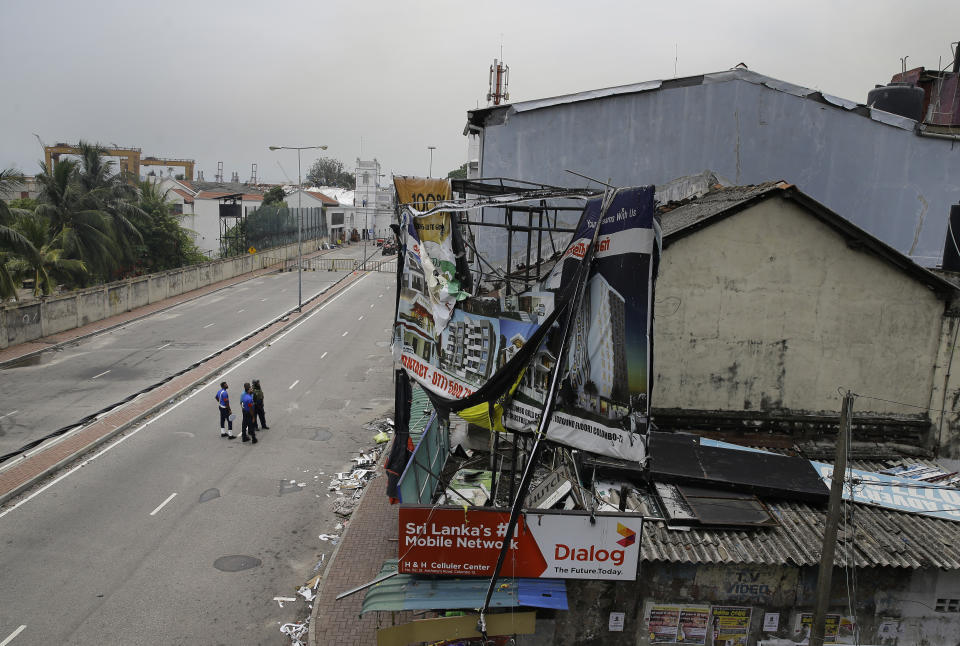 Sri Lankan security guards patrol on a road leading to St. Anthony's Church in Colombo, Sri Lanka, Monday, April 29, 2019. The Catholic Church in Sri Lanka says the government should crack down on Islamic extremists with more vigor "as if on war footing" in the aftermath of the Easter bombings. (AP Photo/Eranga Jayawardena)