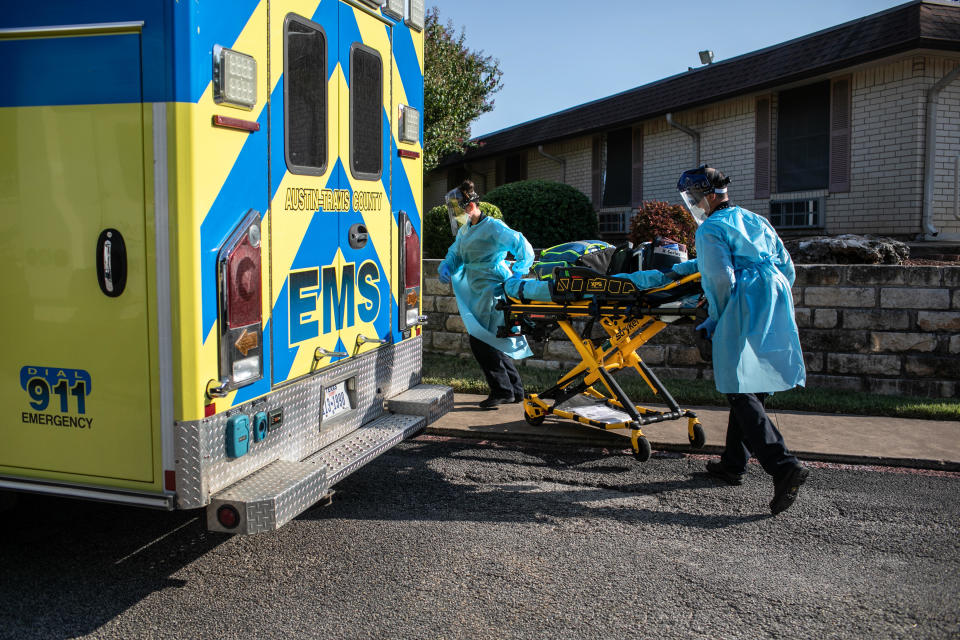 Austin-Travis County medics wearing personal protective clothing (PPE), prepare to enter a nursing home on August 05, 2020 in Austin, Texas. / Credit: John Moore  / Getty Images