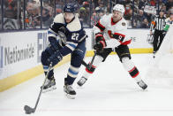 Ottawa Senators' Josh Norris, right, chases Columbus Blue Jackets' Jake Bean behind the net during the first period of an NHL hockey game, Sunday, Jan. 23, 2022, in Columbus, Ohio. (AP Photo/Jay LaPrete)