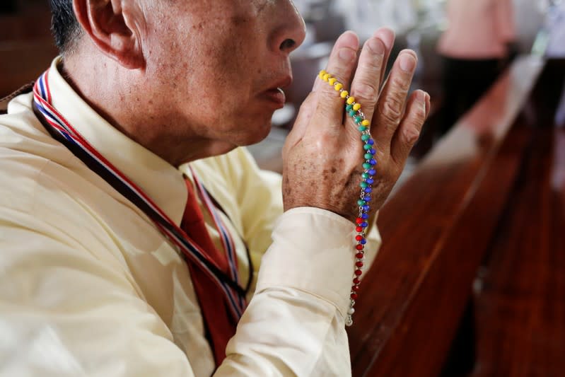 A devotee prays as Pope Francis visits St. PeterÕs Parish church in the Sam Phran district of Nakhon Pathom Province, Thailand