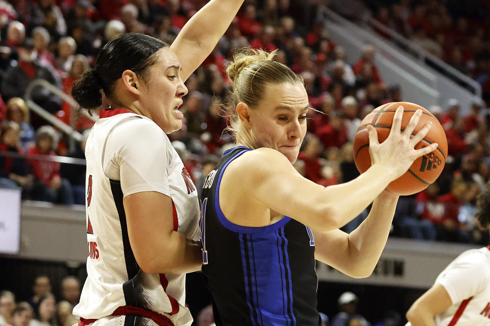 Duke's Camilla Emsbo, right, struggles against North Carolina State's Mimi Collins (2) during the first half of an NCAA college basketball game, Sunday, Jan. 21, 2024, in Raleigh, N.C. (AP Photo/Karl B. DeBlaker)