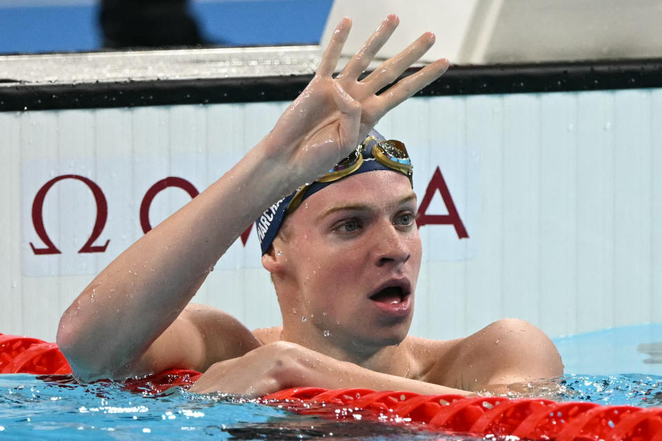 Gold medallist France's Leon Marchand gestures while celebrating after competing in the final of the men's 200m individual medley swimming event during the Paris 2024 Olympic Games at the Paris La Defense Arena in Nanterre, west of Paris, on August 2, 2024. (Photo by Jonathan NACKSTRAND / AFP) (Photo by JONATHAN NACKSTRAND/AFP via Getty Images)