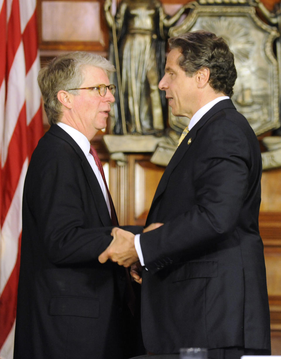 New York Gov. Andrew Cuomo, right, thanks New York County District Attorney Cy Vance, following a news conference at the Capitol in Albany, N.Y., on Monday, June 4, 2012. Cuomo is proposing the decriminalization of the possession of small amounts of marijuana in public view. (AP Photo/Tim Roske)