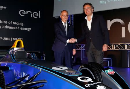 Francesco Starace (L), CEO and general manager of Enel Group, shakes hand with Alejandro Agag (R), Formula E CEO, during a news conference to present their partnership at the MAXXI National Museum in Rome, Italy May 17, 2016 REUTERS/Alessandro Bianchi