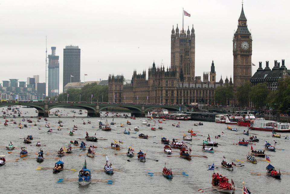 The Diamond Jubilee Thames River Pageant sails past the Houses of Parliament and Big Ben on June 3, 2012 in London.