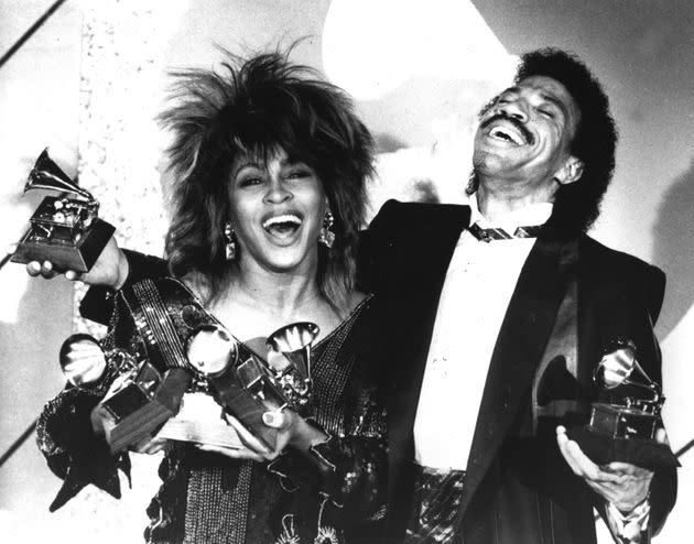 Tina Turner, left, and Lionel Richie pose with a total of five awards between them, at the Grammy Awards show in Los Angeles in 1985.