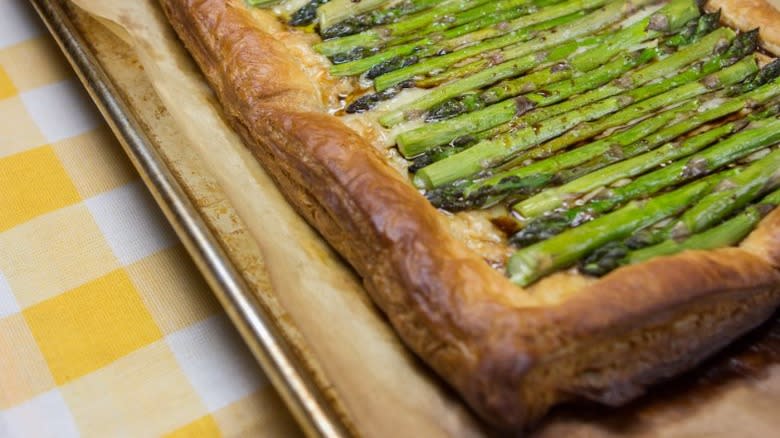 Puff pastry tart with cheese and asparagus