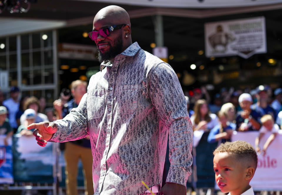 Texas Rangers' Adolis García walks during the baseball All-Star Game red carpet show Tuesday, July 11, 2023, in Seattle. (AP Photo/Lindsey Wasson)