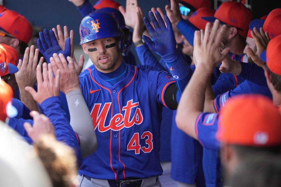 New York Mets left fielder Trayce Thompson (43) is congratulated by teammates after hitting a grand slam against the Washington Nationals in the third inning on Feb. 26, 2024, at CACTI Park of the Palm Beaches in West Palm Beach, Fla.