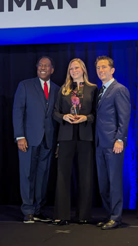 Mardi Norman, CEO of Dynamic Systems, Inc., receives a quality award from Northrop Grumman at the 2024 Supplier Excellence Awards Summit in Tysons Corner, Virginia. Pictured left to right: Ken Brown, VP of Global Supply Chain, NGC Enterprises; Mardi Norman, President and CEO, Dynamic Systems, Inc. Matt Bromberg, Corporate VP of Global Operations, NGC (Photo: Business Wire)