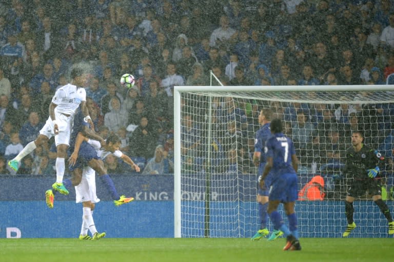 Swansea City's Dutch midfielder Leroy Fer (L) scores from a header during a English Premier League football match between Leicester City and Swansea at King Power Stadium in Leicester, central England on August 27, 2016