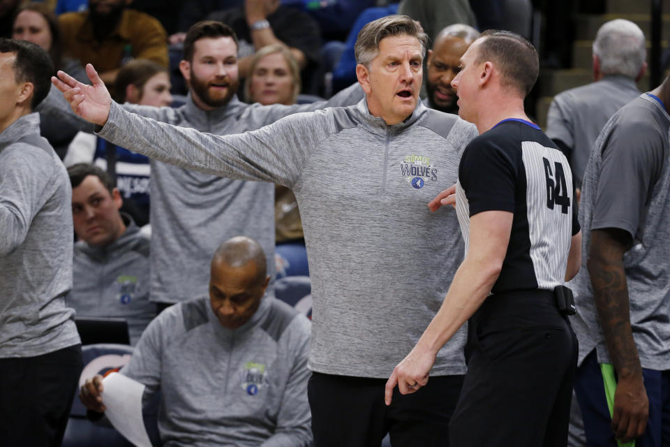 Minnesota Timberwolves coach Chris Finch, front left, questions referee Justin Van Duyne on a call during the third quarter of the team's NBA basketball game against the Boston Celtics on Wednesday, March 15, 2023, in Minneapolis. The Celtics won 104-102. (AP Photo/Bruce Kluckhohn)