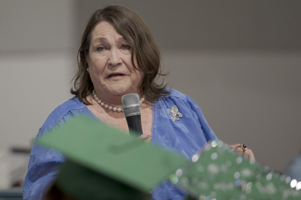 Kitty Sibley Morrison, principal and founder of the Springfield Preparatory School, speaks during a graduation ceremony of the school at Victory in Christ church in Holden, La., Saturday, Aug. 5, 2023. Nearly 9,000 private schools in Louisiana don’t need state approval to grant degrees. Non-approved schools make up a small percentage of the state total. But the students in Louisiana’s off-the-grid school system are a rapidly growing example of the national fallout from COVID-19 — families disengaging from traditional education. (AP Photo/Matthew Hinton)