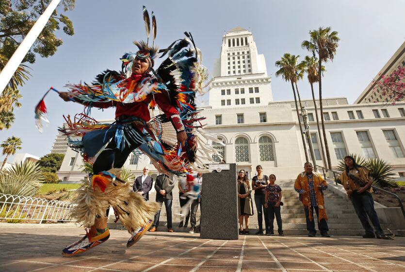 LOS ANGELES, CA - OCTOBER 10, 2019 Kenneth Thomas Shirley, a Navajo Nation champion dancer and the CEO of Indigenous Enterprise performs a Men's Fancy War Dance at Los Angeles City Hall Thursday October 10, 2019 in advance of the city's Indigenous People's Day set to take place this Sunday, October 13 at 4 p.m., with a stage at the Spring Street steps of City Hall. The celebration at Grand Park is being billed as one of the largest Indigenous Peoples Day celebrations in the country. In collaboration with countless Native community leaders, Councilmember Mitch O'Farrell, a member of the Wyandotte Nation, led the initiative to replace Columbus Day with Indigenous Peoples Day during his first term in office. After numerous hearings with members of both the Native American and Italian American communities, the City Council voted in August of 2017 to establish Indigenous Peoples Day as the second Monday in October. (Al Seib / Los Angeles Times)