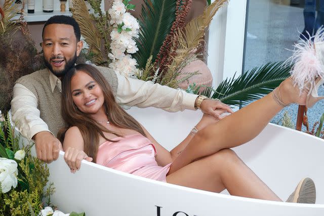 <p>Stefanie Keenan/Getty</p> (L-R) John Legend and Chrissy Teigen attend LOVED01 By John Legend Launches Pop-Up At at Westfield Century City