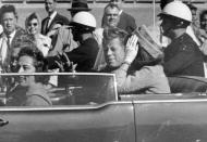 <p>President John F. Kennedy waves from his car in a motorcade approximately one minute before he was shot in Dallas on Nov. 22, 1963. Riding with Kennedy are First Lady Jacqueline Kennedy, right, Nellie Connally, second from left, with her husband, Texas Gov. John Connally, on her left. The National Archives has until Oct. 26, 2017, to disclose the remaining files related to Kennedy’s assassination, unless President Donald Trump intervenes. (Photo: Jim Altgens/AP) </p>