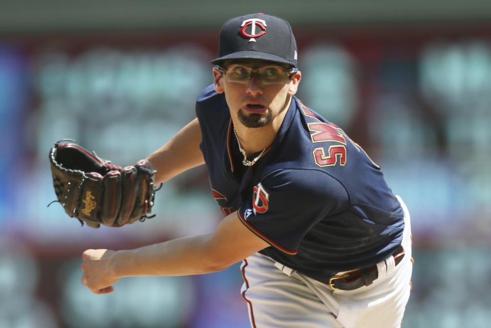 FILE - In this Aug. 4, 2019, file photo, Minnesota Twins pitcher Devin Smeltzer watches a pitch against the Kansas City Royals in the sixth inning of a baseball game in Minneapolis. The Twins remain publicly confident in the rotation anchored by returning veterans Jose Berrios and Jake Odorizzi and supplemented by youngsters like Smeltzer, Randy Dobnak and Lewis Thorpe. (AP Photo/Jim Mone, File)