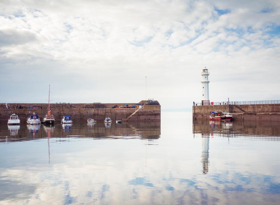 The lighthouse on the harbour walls of Newhaven harbour, part of Edinburgh’s Wardie Bay waterfront (Getty)