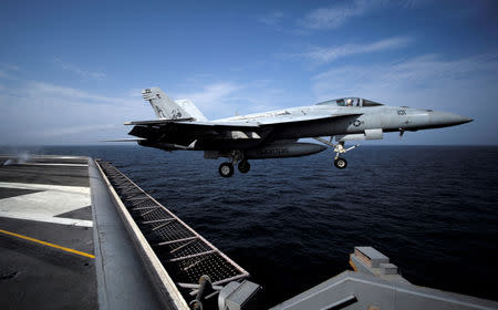 FILE PHOTO: An F/A-18E Super Hornet of Strike Fighter Squadron (VFA) 31, is catapulted off the flight deck of the U.S. aircraft carrier, USS George H. W. Bush in Gulf of Oman in this photo taken on March 20, 2017. REUTERS/Hamad I Mohammed/File Photo