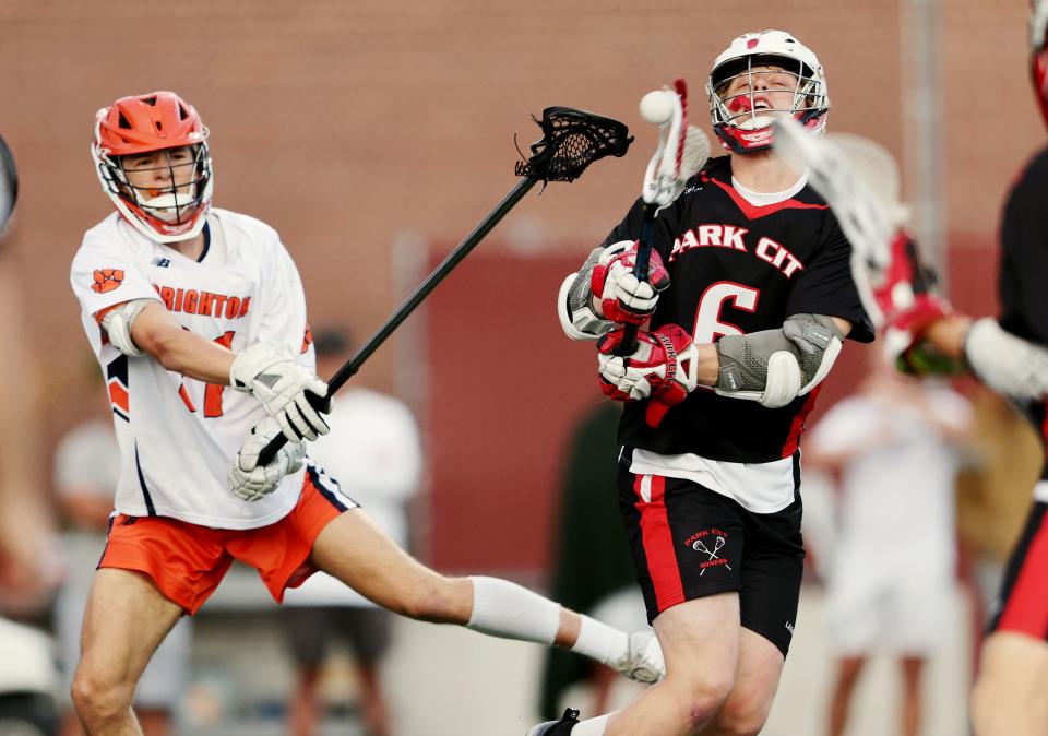 Brighton’s Ethan Salmon, swings at Park City’s Jack Ronan, as he tries to shoot as they play in semifinal lacrosse action at Westminster in Salt Lake City on Wednesday, May 24, 2023. | Scott G Winterton, Deseret News