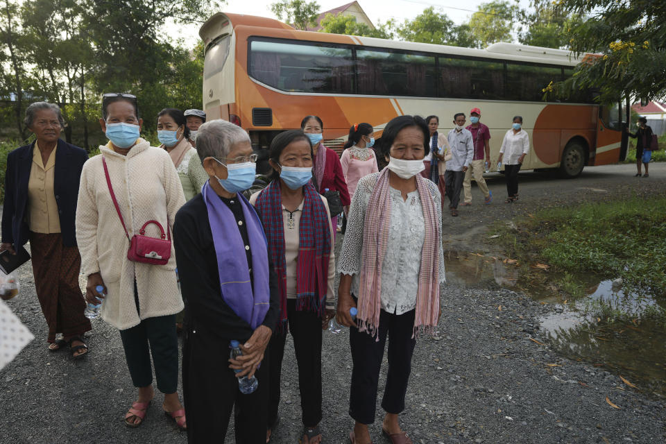 Villagers arriving for the hearings against Khieu Samphan, former Khmer Rouge head of state, at the U.N.-backed war crimes tribunal in Phnom Penh, Cambodia, Thursday, Sept. 22, 2022. The tribunal will issue its ruling on an appeal by Khieu Samphan, the last surviving leader of the Khmer Rouge government that ruled Cambodia from 1975-79. He was convicted in 2018 of genocide, crimes against humanity and war crimes and sentenced to life in prison. (AP Photo/Heng Sinith)