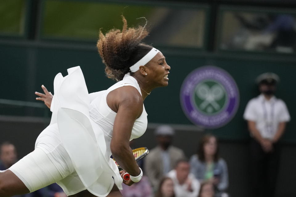FILE - Serena Williams serves to Aliaksandra Sasnovich of Belarus during the women's singles first round match on day two of the Wimbledon Tennis Championships in London, Tuesday June 29, 2021. Serena Williams plans to make her return to singles competition via a wild-card entry at Wimbledon. (AP Photo/Kirsty Wigglesworth, File)